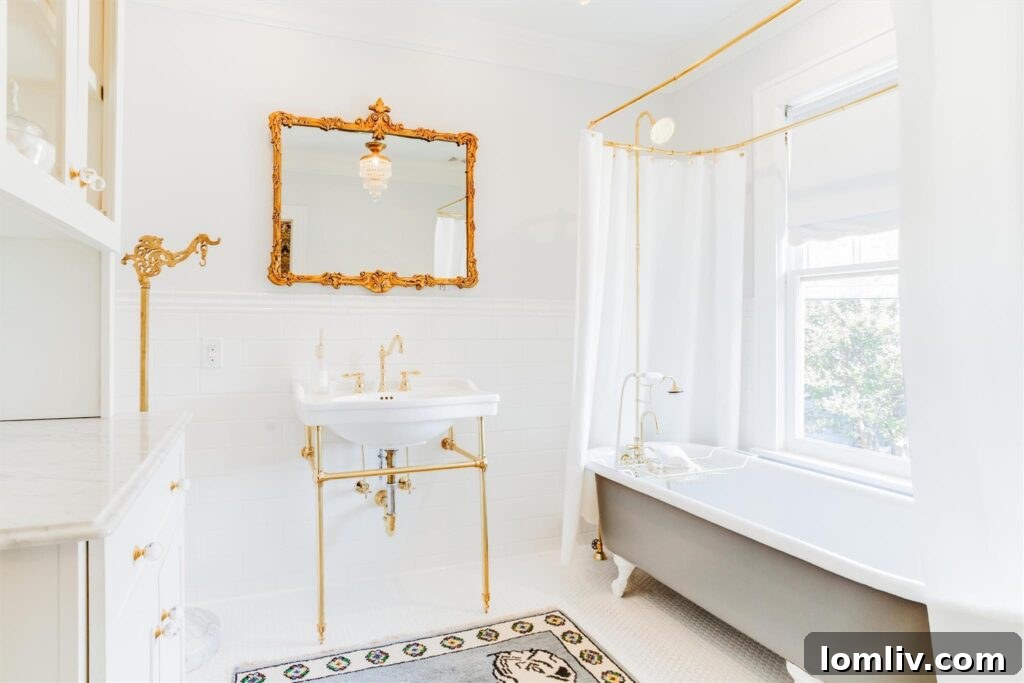 Fort Worth Craftsman A Colorful Renovation Fueled by Love 8 Elegant staircase with restored wood trim and vintage details in Ryan Place
