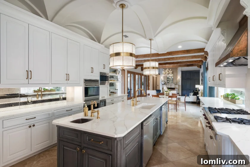 A gourmet kitchen showcasing high-end appliances including a 48-inch Wolf gas range, double ovens, and integrated Sub-Zero refrigeration.