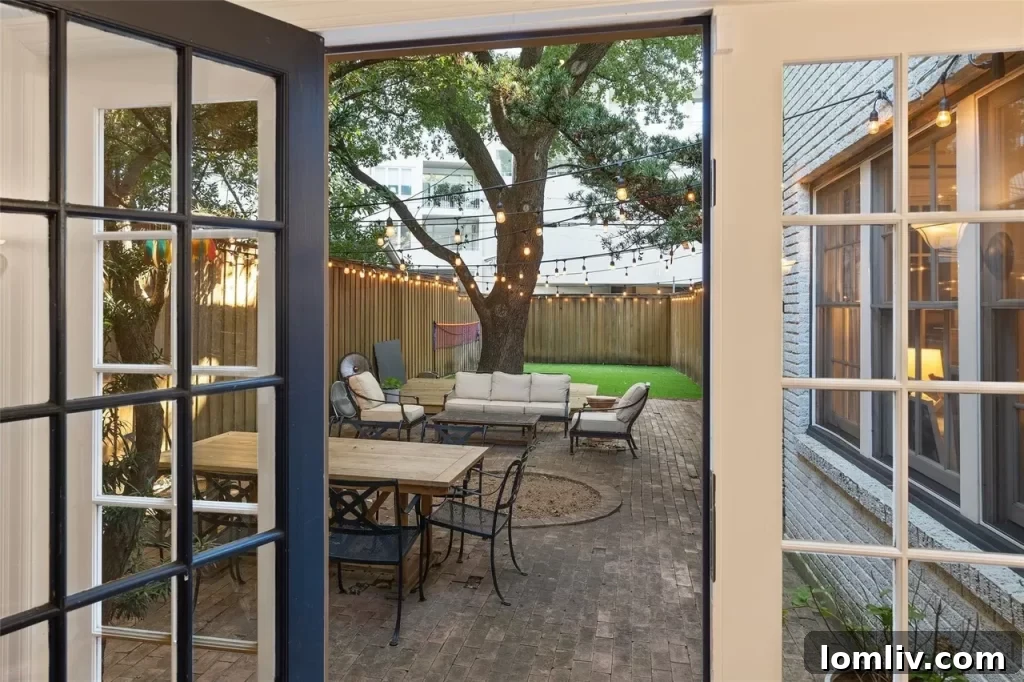 Spacious living room of the lower unit in Highland Park triplex, featuring modern updates and natural light