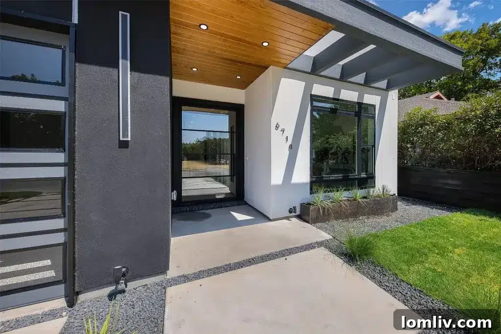 Exterior view showcasing an extended balcony and numerous windows