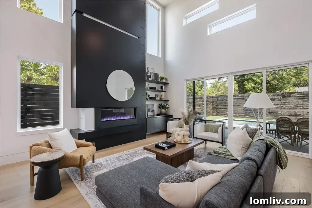 Spacious living room with high ceilings and tall windows