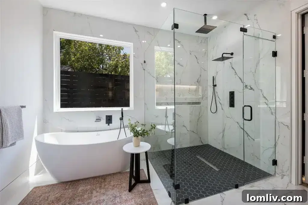 Luxurious primary bathroom with soaking tub and walk-in shower