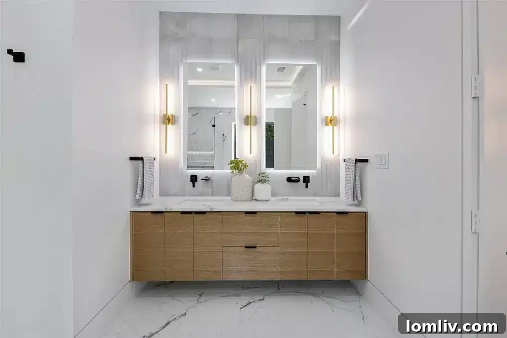 Ensuite bathroom featuring dual vanities and modern design