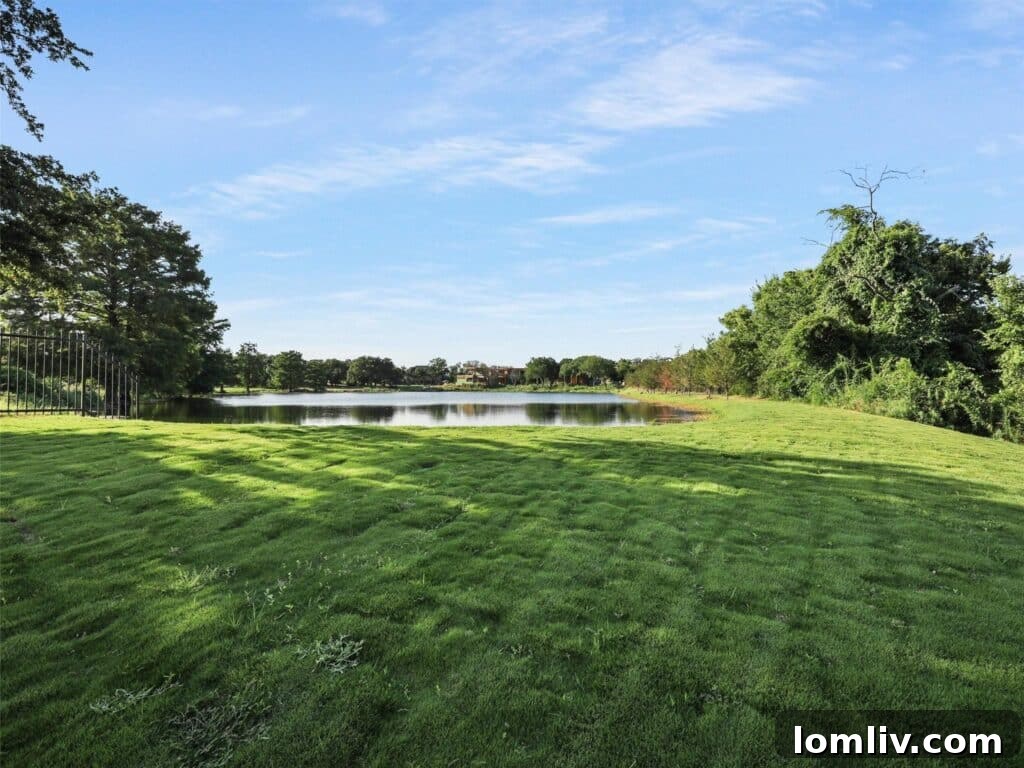 Westlake's Quail Hollow: Redefining Modern Luxury 22 Expansive backyard leading down to the lake, offering unparalleled privacy and natural beauty.