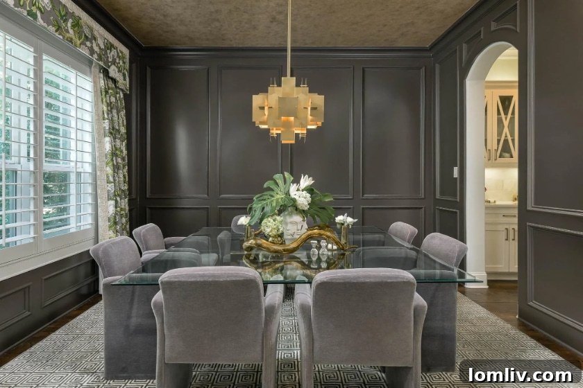 Living room with Jonathan Adler chandelier and gold leaf ceiling in Briarwood home
