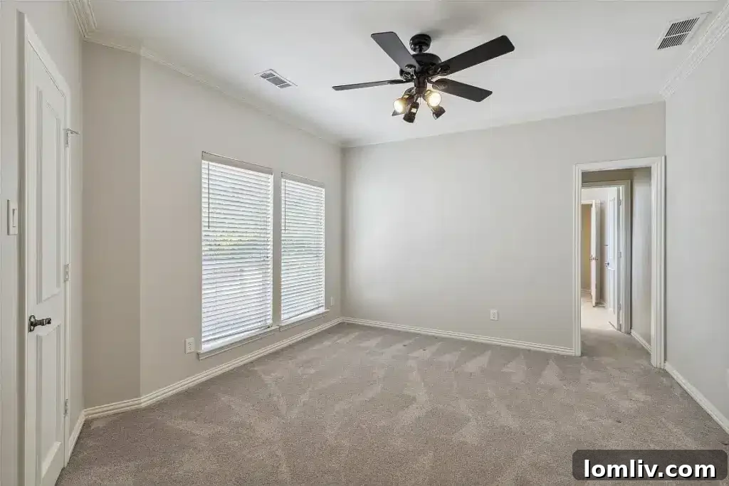 Stylish soaking tub in a bright, modern primary bathroom.