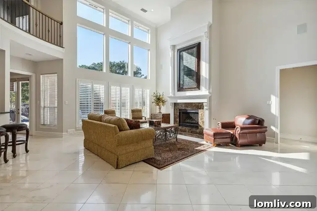 Bright, open living space with large windows overlooking lush greenery.