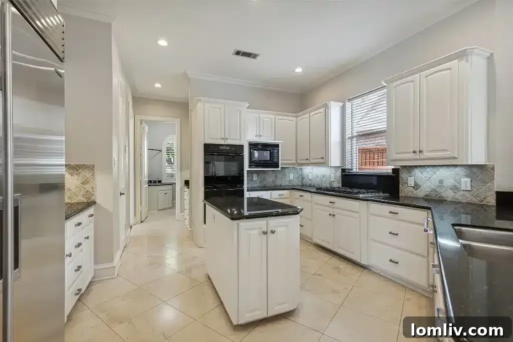 Elegant living room with a grand fireplace and tasteful decor.