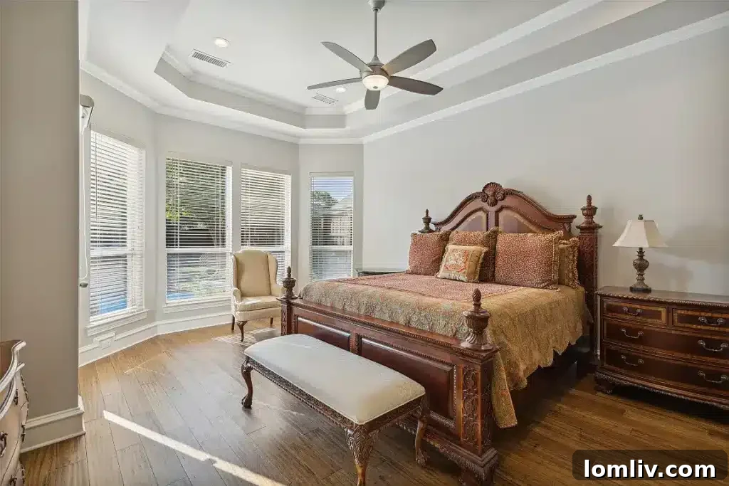 Comfortable family room with a view of the backyard pool and greenery.