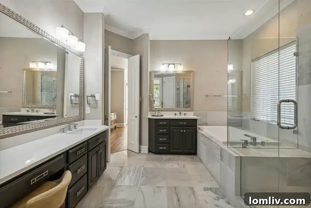 Luxurious primary bedroom with access to a private patio.