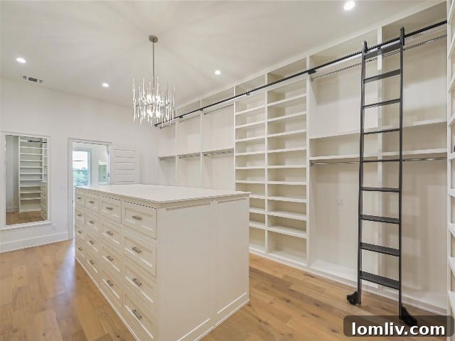Rancho Ladera: Ample Room, Right Where You Need It 9 Luxury primary closet with custom built-ins and a rolling ladder