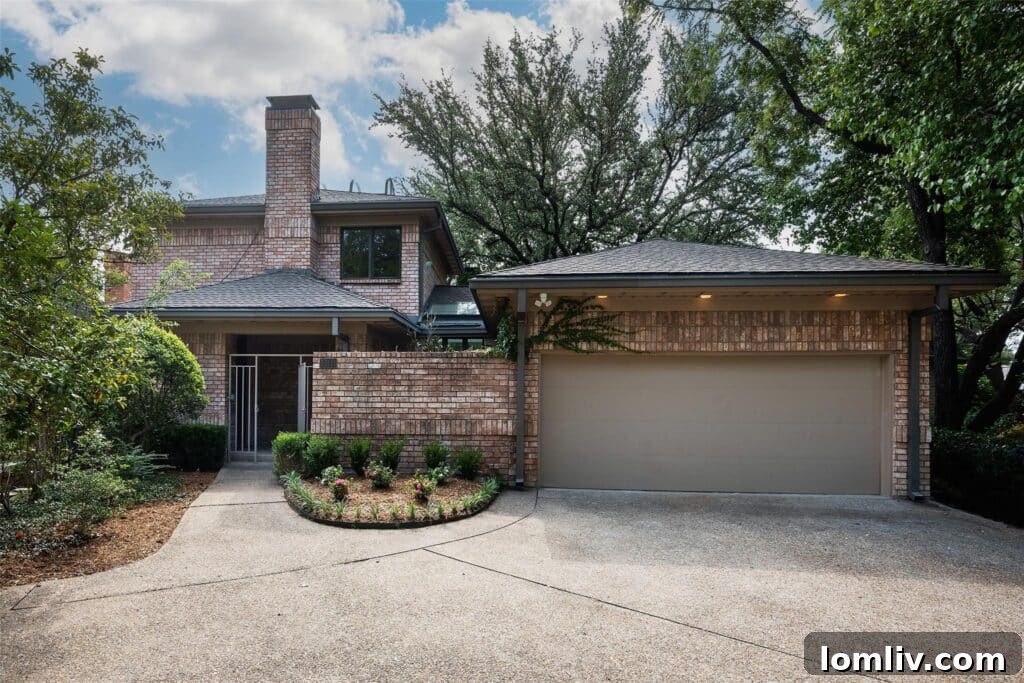 Modern interior of a luxury North Dallas home with high ceilings, expansive windows, and a clear view of the private lake.