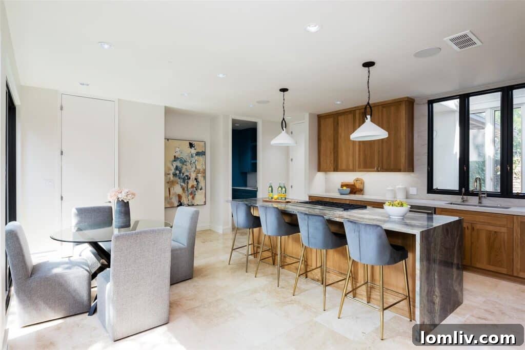 Gourmet kitchen in the Parc Du Lac Estates home, featuring elegant oak cabinets, state-of-the-art Wolf, Sub-Zero, and Bosch appliances.