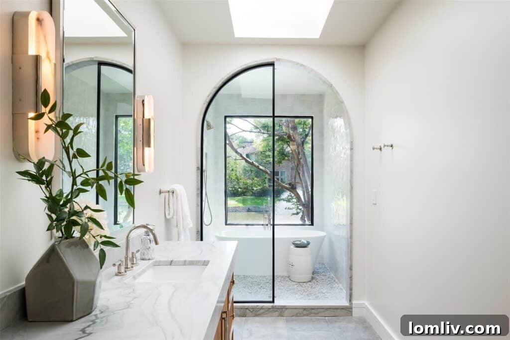 Elegant primary bathroom with bespoke fluted oak cabinets, modern fixtures, heated flooring, and a sophisticated wet room.