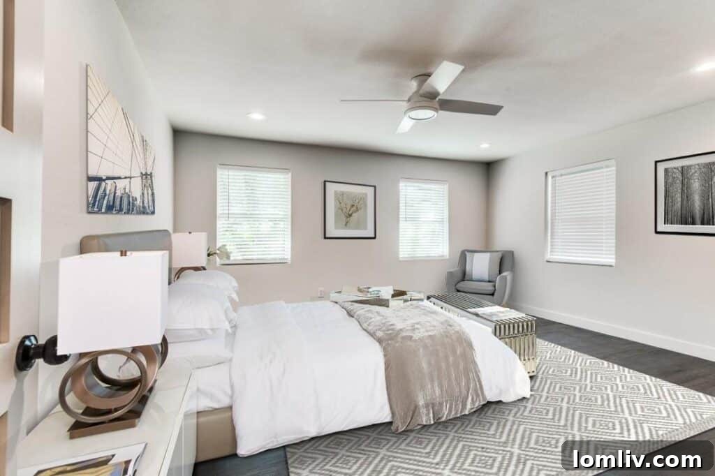 Renovated bathroom with sleek tiling and modern fixtures, reflecting quality in affordable housing.