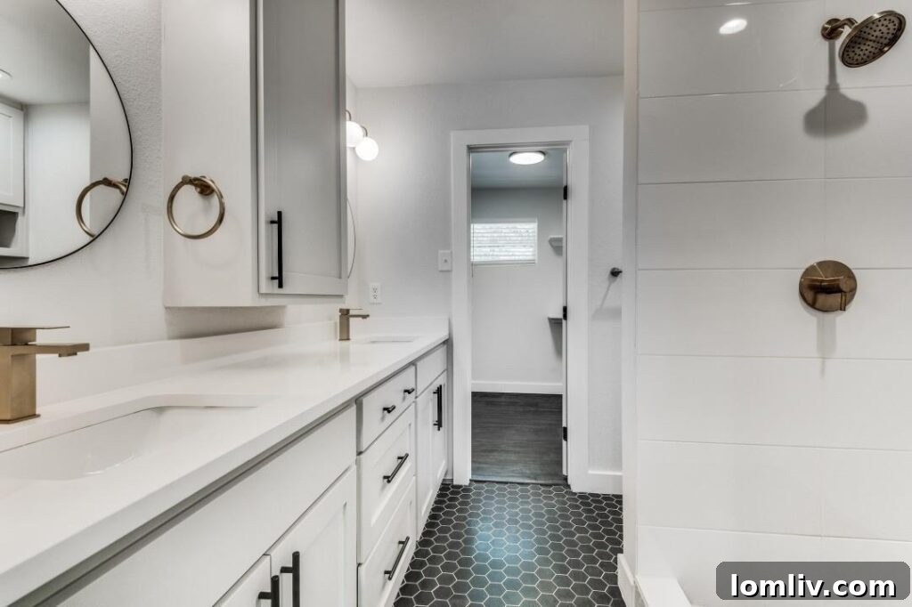 Bright and airy bedroom in a renovated South Dallas home, showcasing modern interior design.