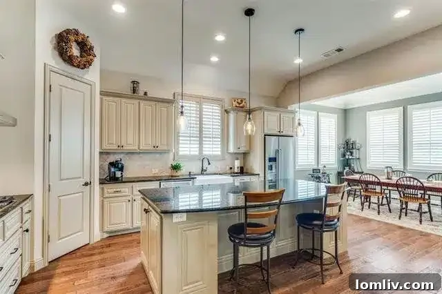 Dining options in a McKinney home, including a kitchen island and a separate dining area.
