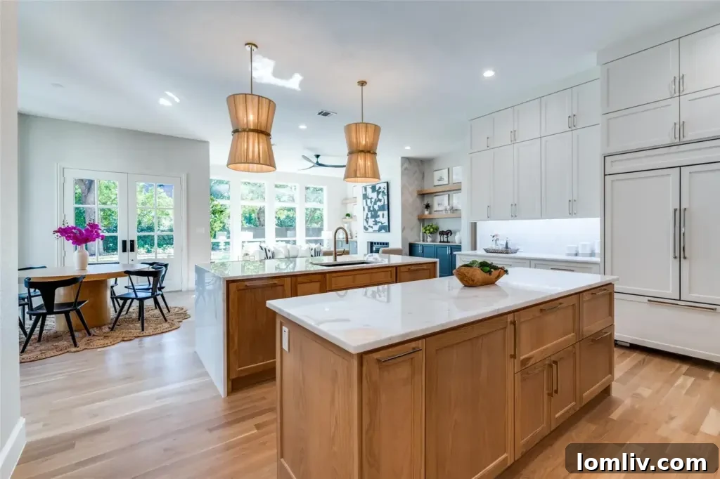 Spacious modern kitchen featuring professional-grade appliances and stylish Brizo fixtures