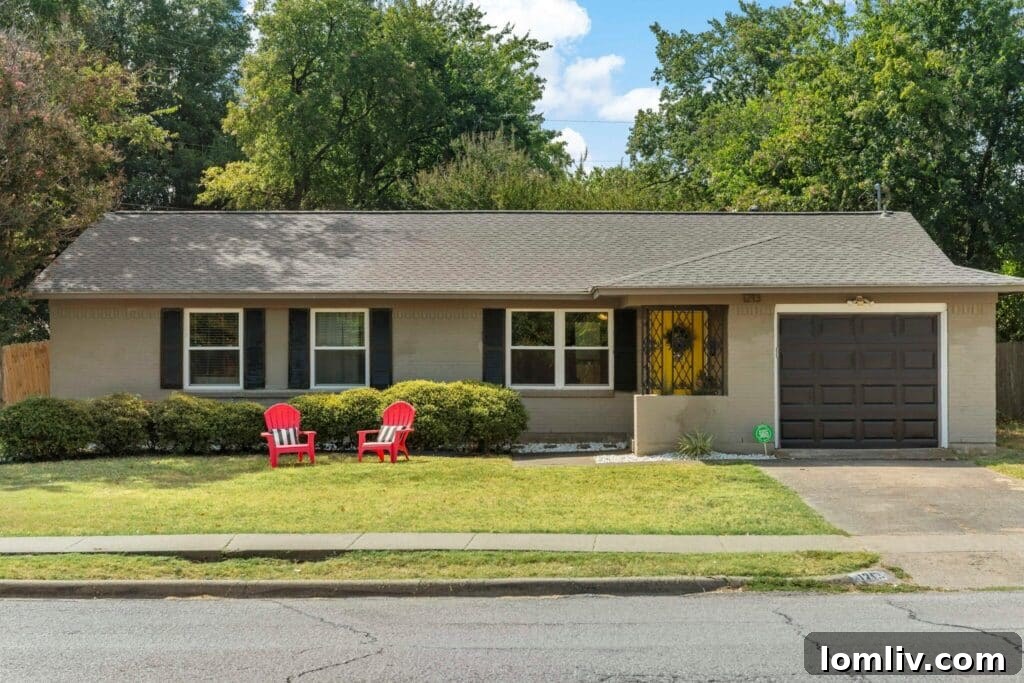 A charming Richardson home exterior with a vibrant yellow front door.