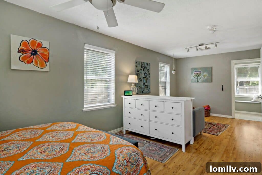 A modern kitchen with updated appliances and a breakfast bar.