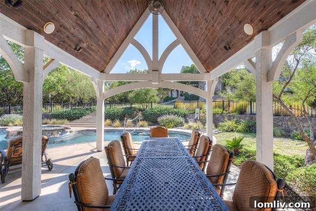 Outdoor kitchen and dining area by the pool