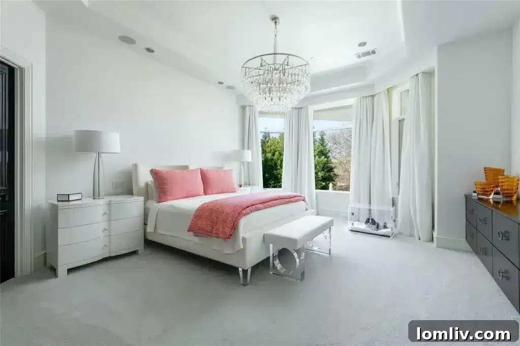 Luxurious master bedroom with plush furnishings and natural light