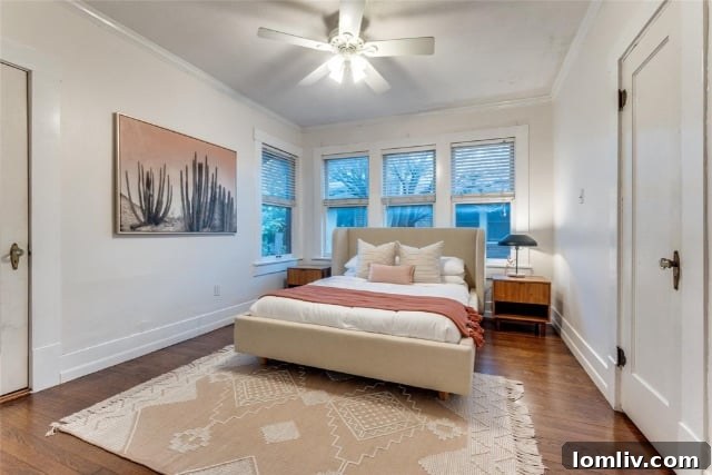 Living room with a distinctive green accent wall and a brick fireplace