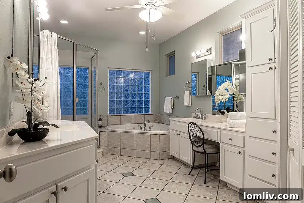 Luxurious master suite with private balcony at 218 Scenic Drive, offering scenic views