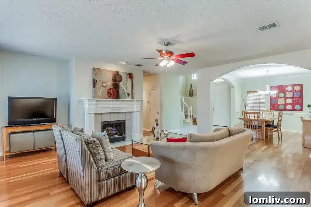 Bright living room with fireplace at 3223 Newhaven Drive, Highland Village