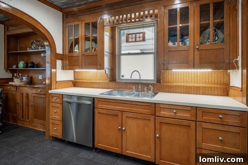 Three Words, Timeless Charm: This Hampton Hills Tudor Sold Instantly 5 Original brick fireplace and hardwood floors