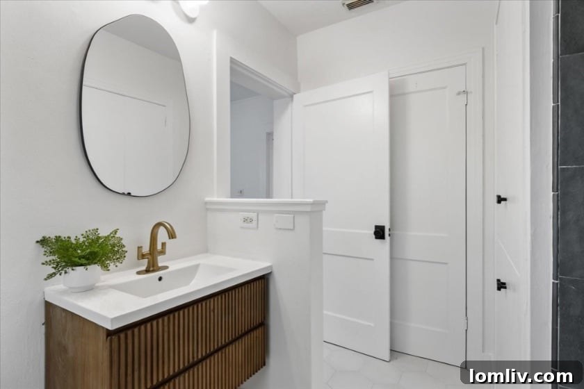 Another view of an interior space, possibly a secondary bedroom or flexible living area, with elegant furnishings and an abundance of light, underscoring the home's adaptable design.