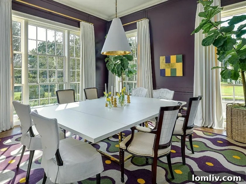 The stately entrance of the new home at 3616 Crescent Avenue, featuring large steel doors and a welcoming stone facade.