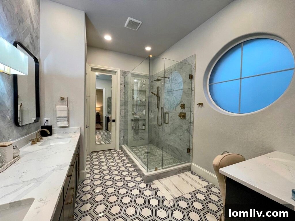 Luxurious Primary Bathroom with Marble and Brass Hardware