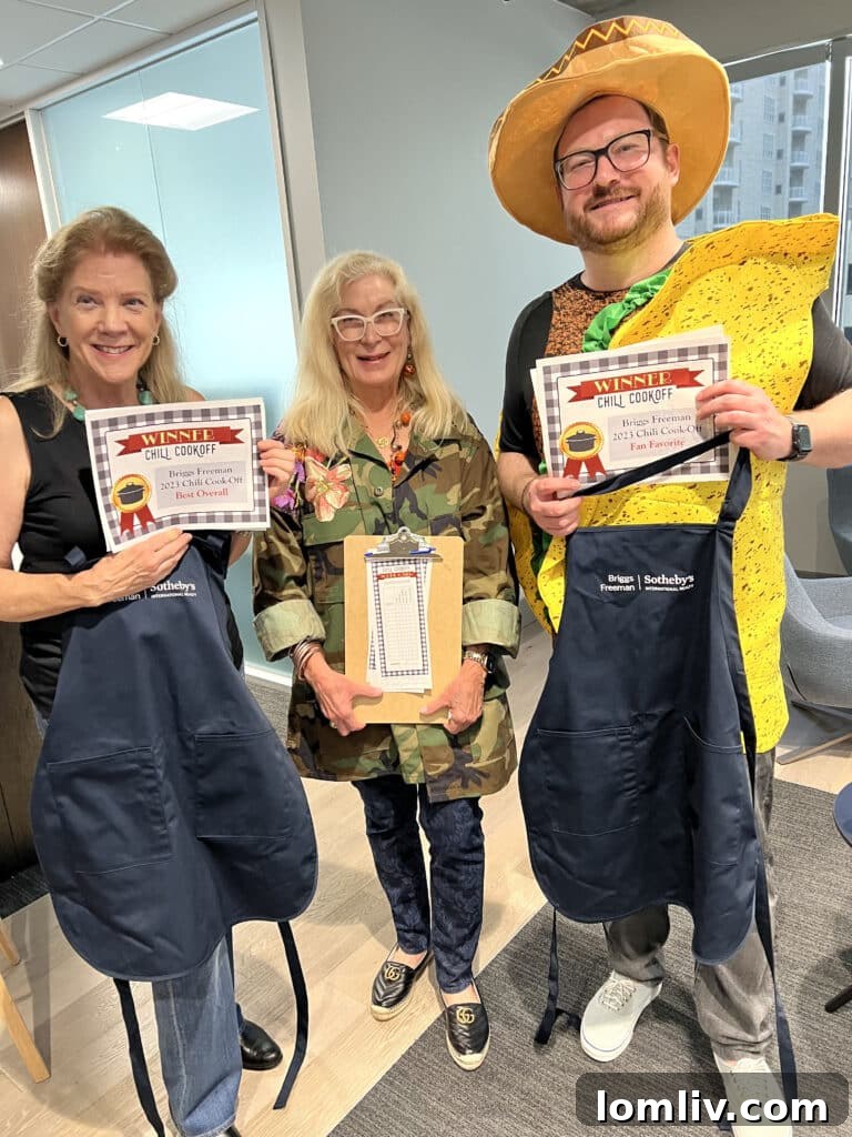 Barbara Kurilecz, Candy Evans, and Patrick Bukowitz celebrating their chili cook-off awards.