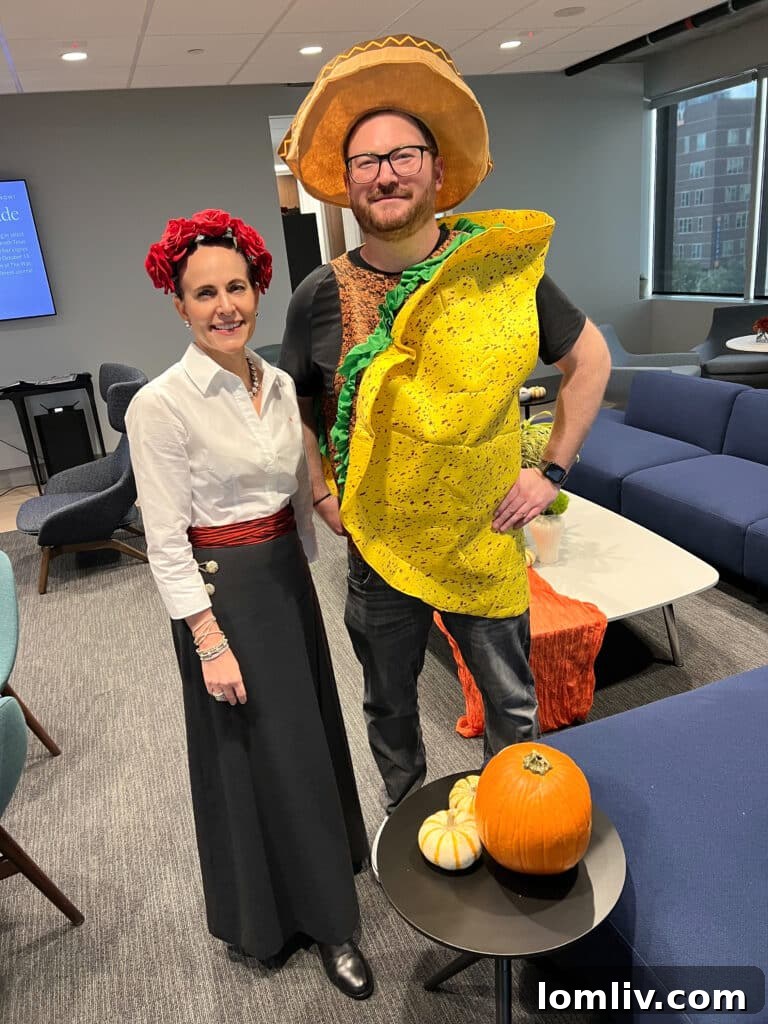 Maria Cintron, Executive Vice President of Marketing, congratulating Patrick Bukowitz.