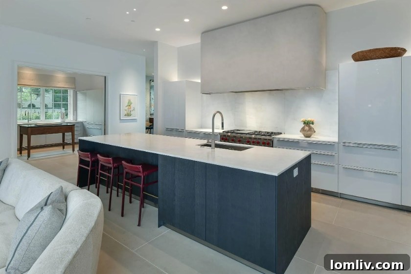 Modern Bulthaup kitchen with custom plaster vent hood and island
