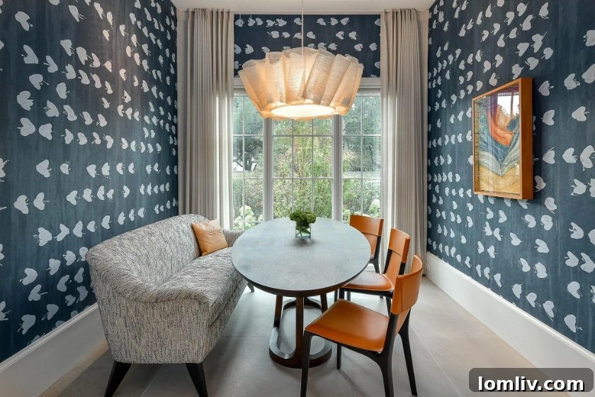 Breakfast room with hand-painted Porter Teleo wallpaper and modern table