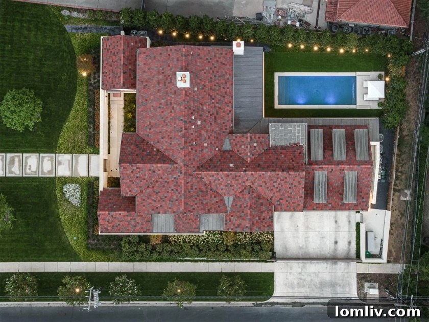 Inviting swimming pool with integrated spa and comfortable lounge areas