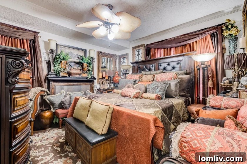 Bathroom featuring a plush chair with pillows and elaborate draperies