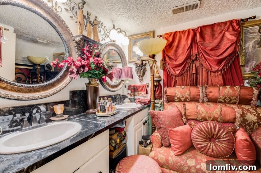 Master bathroom with a toilet and a decorative chair, adorned with pillows