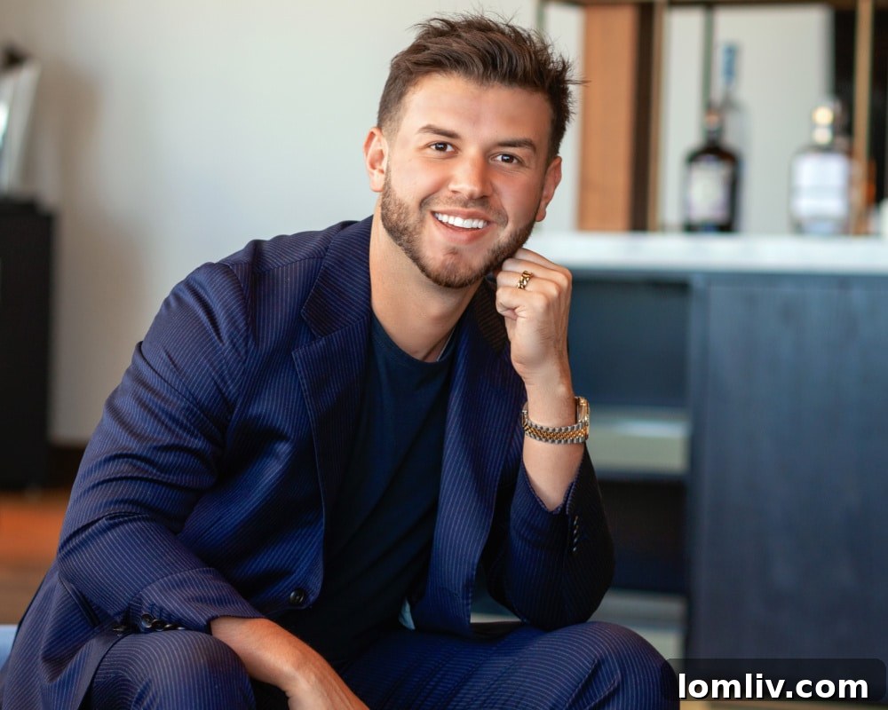 Chase Duran, a prominent real estate agent, stands confidently in a luxurious modern home, embodying professionalism and success in the Dallas-Fort Worth luxury real estate market.