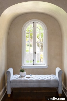 Unveiling a Historic Dines and Kraft Tudor at This Weekends Lakewood Home Tour 8 A bright and inviting living space in a restored Lakewood historic home, blending classic and contemporary elements.