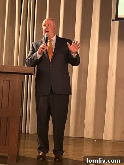 James Tobin presenting on housing policy and regulations.