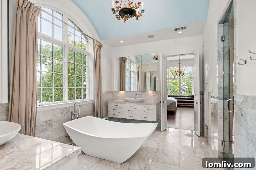 Elegant Primary Bathroom with Freestanding Tub and Dual Vanities