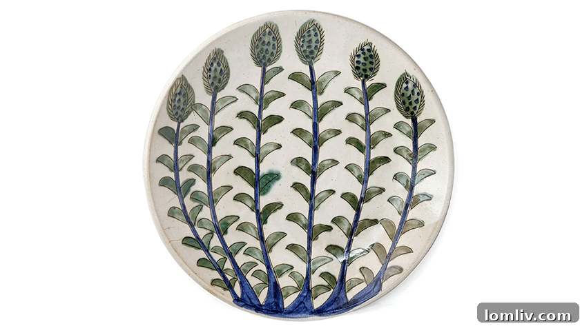 Handcrafted blue and green budding flower platter from the oasis village of Tunis in Fayoum, a unique serving piece.