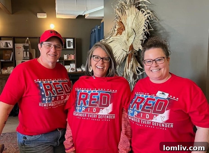 Members of the WCR Fort Worth Tarrant Network proudly displaying their 'Remember Every Defender' t-shirts, showcasing their support for veterans.