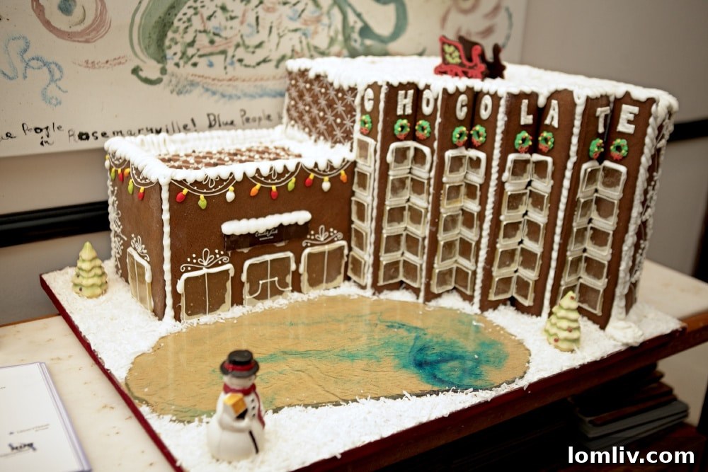 A close-up of another intricately designed gingerbread house, showcasing fine details and festive decorations, part of the Highland Park Village Gingerbread Stroll.
