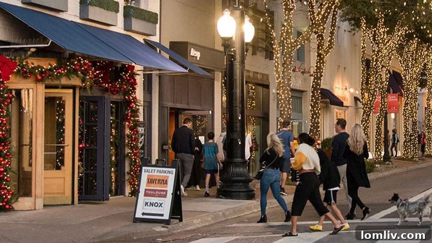 Children enjoying a festive photo opportunity with Santa Paws at the Knox Street Celebration.