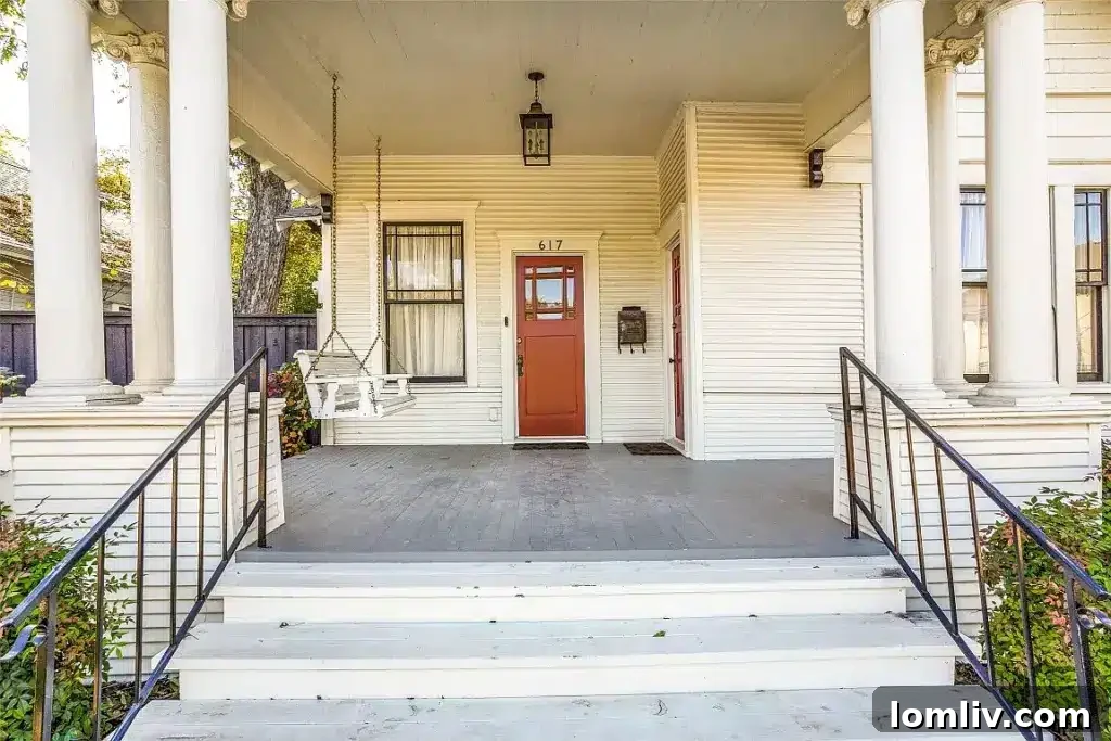 Large front porch with towering pillars on a historic Dallas home