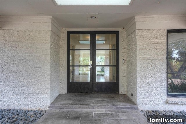 Elegant steel double doors perfect for holiday decor, 6101 Merrymount Road.